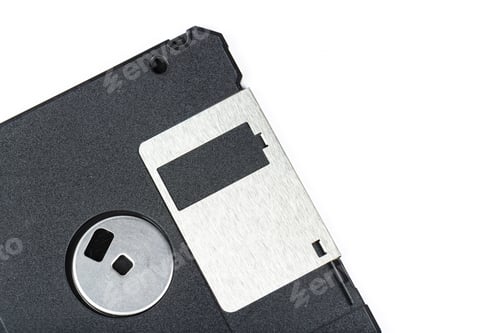 Preview: Vintage floppy disk with metallic label placed on a white background