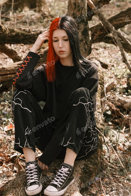 Preview: A young girl is sitting in the park