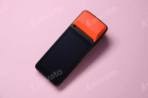 Preview: One payment terminal on pink background, top view