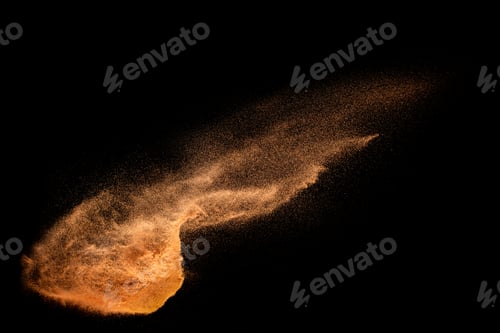 Preview: Brown sand explosion isolated on black background. Freeze motion of sandy dust splash.