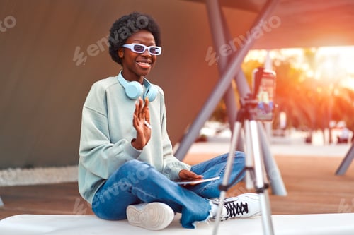 Preview: African American woman wearing headphones