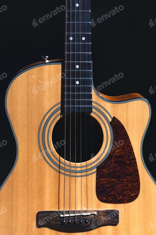 Preview: Acoustic guitar on a black background, flat lay.