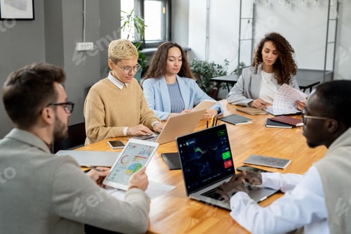 Preview: Large group of financier working by table