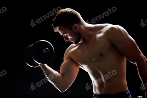 Preview: Muscular man doing dumbbell exercises