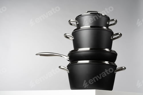Preview: New domestic cookware on grey background close up