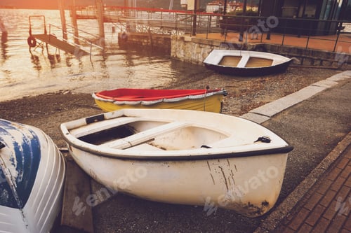 Preview: Row boats on the shore.