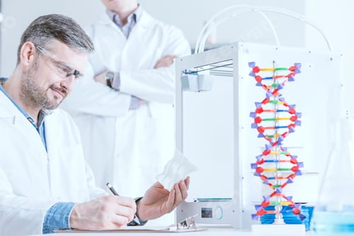 Preview: Scientist holding 3d model