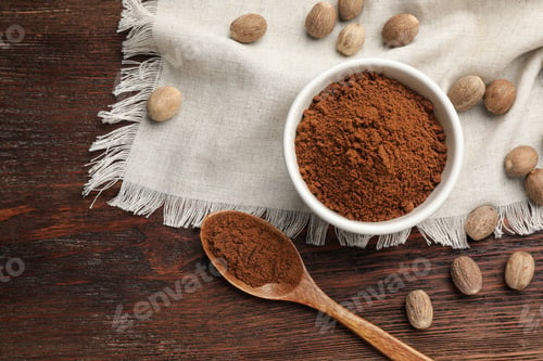 Preview: Flat lay composition with nutmeg powder and seeds on wooden table