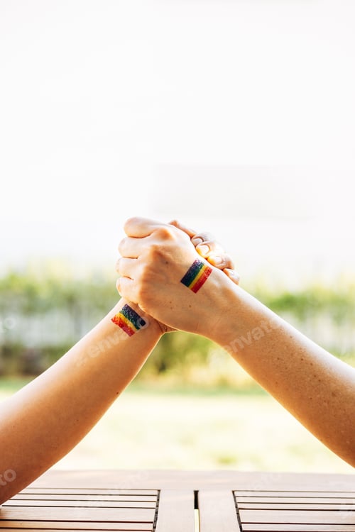 Preview: Hands united with the rainbow flag, symbol of diversity and love, lgtb concept
