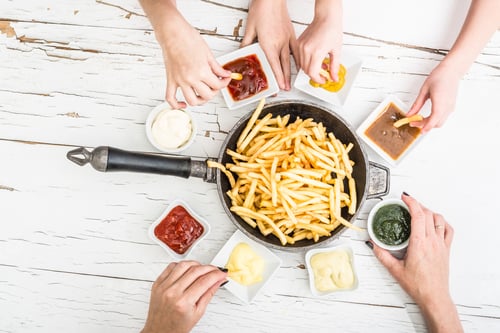 Preview: Family having french fries for dinner top view