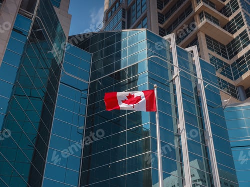 Preview: Flag of Canada flying against a blue sky.