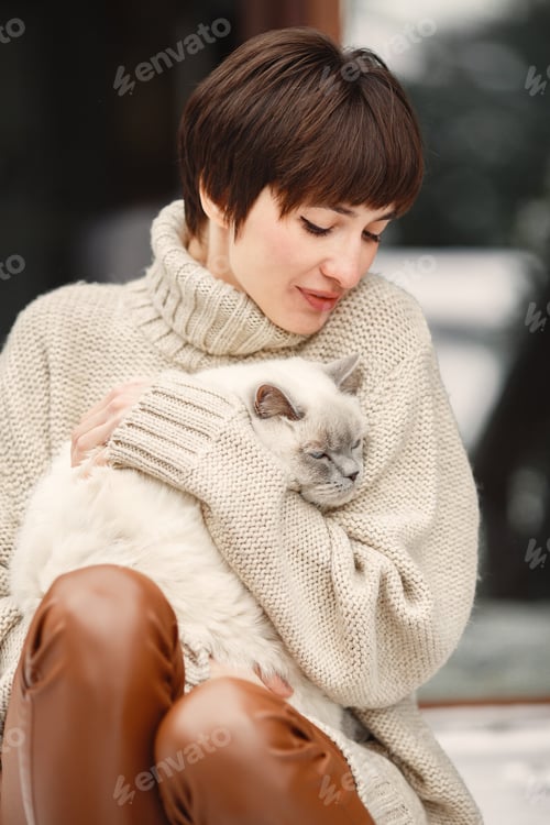 Preview: Outdoor photo of cozy female on the terrace