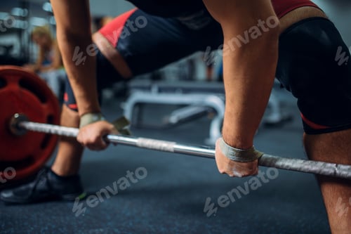 Preview: Male athlete prepares to pull the barbell