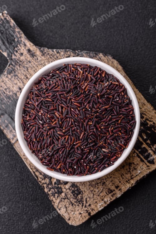 Preview: Red or brown raw rice in a ceramic bowl
