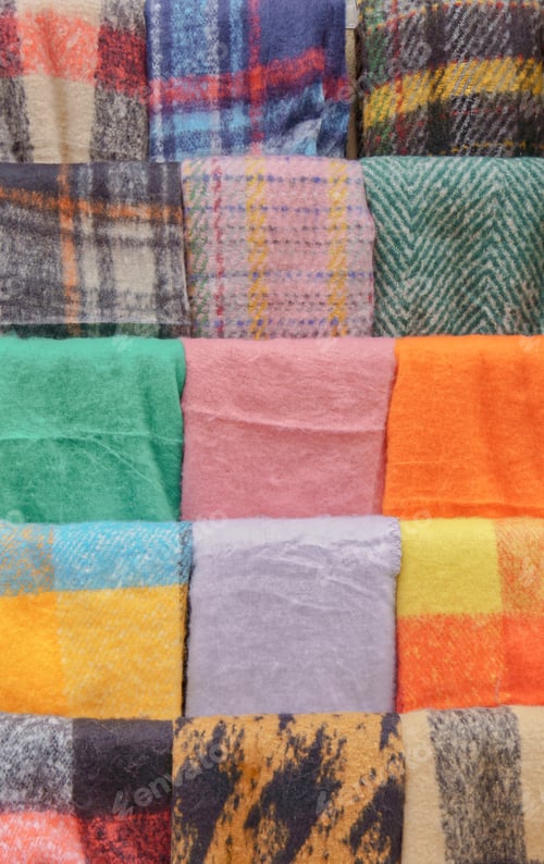 Preview: scarves folded on a display stand
