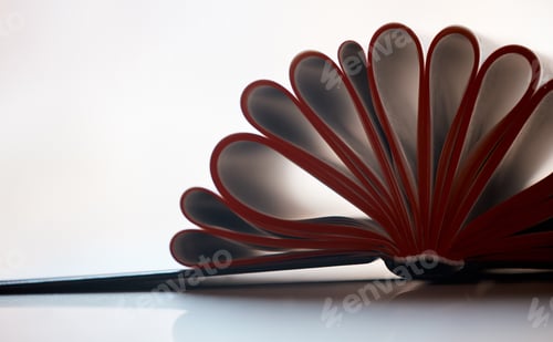 Preview: An open book isolated on white background with copyspace. Education and studying is the idea here.