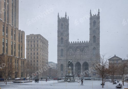 Preview: Basilica of Notre-Dame of Montreal and Place d'Armes during a snowstorm - Montreal, Quebec, Canada