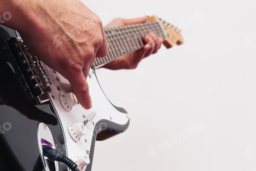 Preview: Guitarist playing musical instruments (focus on hand). pop, heavy, folk, grunge.