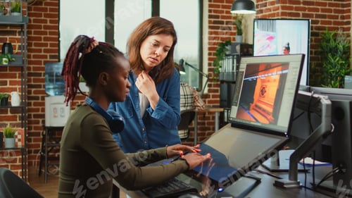 Preview: Diverse colleagues analyzing game developing electronics