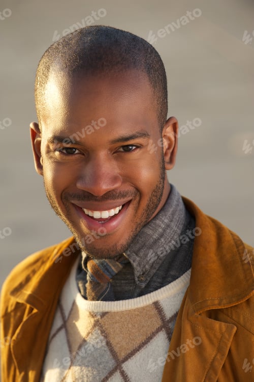 Preview: Portrait of an attractive young african american man smiling outdoors