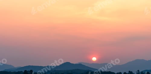 Preview: Sunset sky clouds over mountains in the evening with orange sunlight, Landscape horizon view outdoor