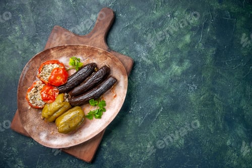 Preview: top view tasty vegetable dolma on dark blue background food dish oil cook cuisine meal color dinner