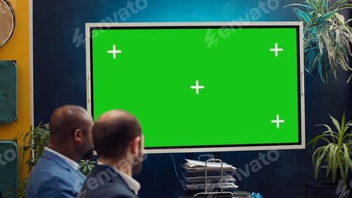 Preview: Promotions manager and team members watching a video on mockup screen