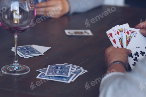 Preview: People playing cards and drinking wine