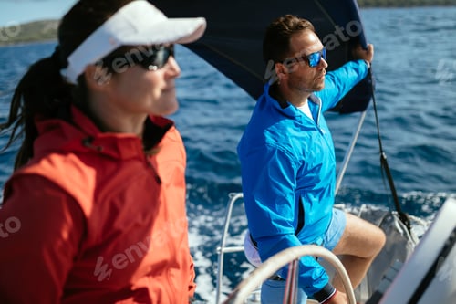 Preview: Attractive strong woman sailing with her boat