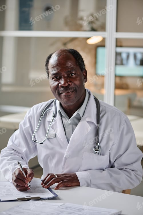 Preview: African male pediatrician working at office