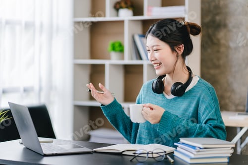 Preview: Cheerful Woman in Video Conference Holding Coffee Cup