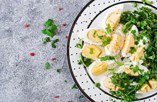Preview: Boiled eggs with greens. Healthy food. Summer salad. Top view