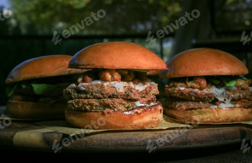 Preview: Closeup shot of hamburgers on the wooden background