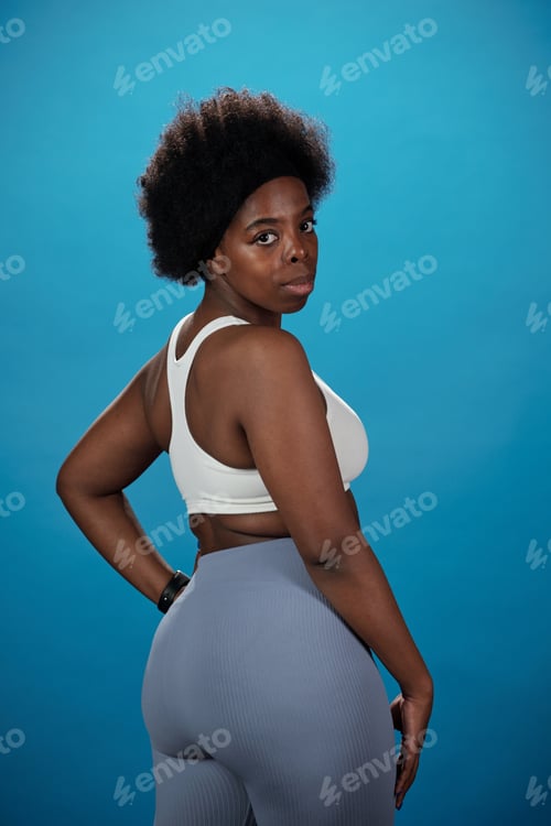 Preview: Serious plus size female in activewear looking at you