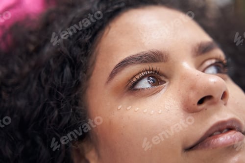 Preview: Lady lies with open brown eyes looking to the left