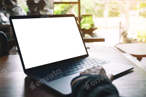 Preview: a woman using and touching on laptop touchpad with blank white desktop screen