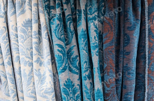 Preview: Closeup shot of surfaces and textures of folded fabrics cloth found at a fabrics market
