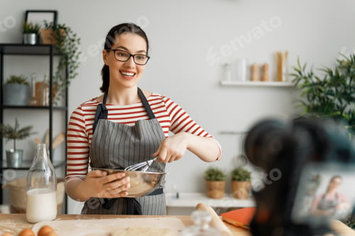Enthusiastic Woman Baking at Home and Filming