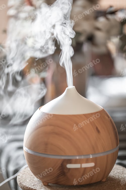 Preview: Modern oil aroma diffuser close up on a blurred background.
