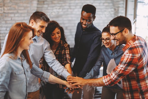 Preview: Young people showing team spirit focus on hands