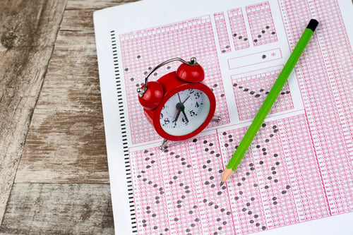 Preview: Exams quiz test paper with pencil drawing selected choice on answer sheets at school