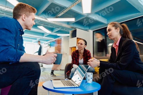 Preview: Multiethnic startup business team on meeting in a modern bright open space coworking office