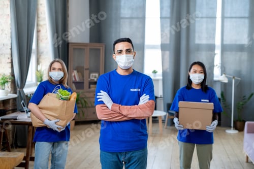 Preview: Three intercultural volunteers in protective masks