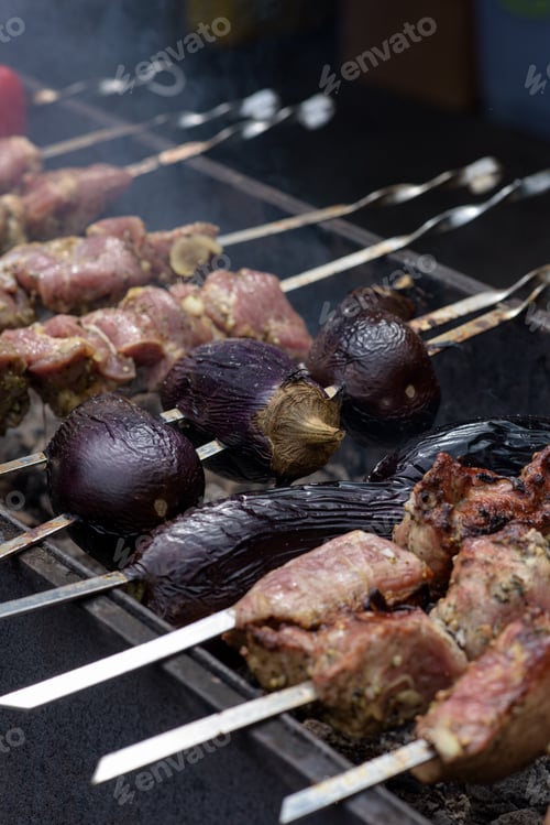 Preview: Grilled meat and vegetables on skewers at a street food festival.