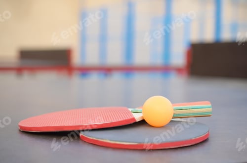 Preview: rackets and ball on Ping pong table in outdoor sport yard. Active sports