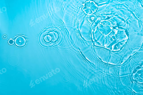 Preview: transparent blue colored clear calm water surface texture with copy space