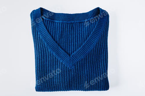 Preview: Sweater. Blue folded sweater isolated on white background.