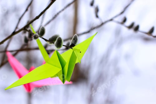 Preview: Bright origami paper cranes on the branches of a willow. The concept of hope, happiness, peace.