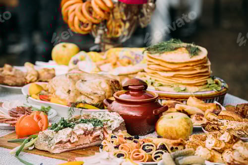 Preview: Dishes of the traditional Belarusian cuisine - pancakes, pancakes with caviar, lard, bacon, baked