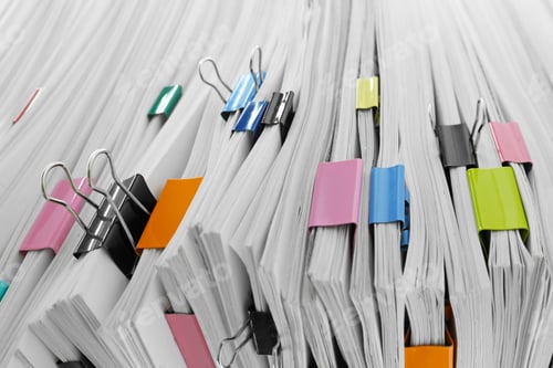 Preview: Pile of documents with colorful binder clips